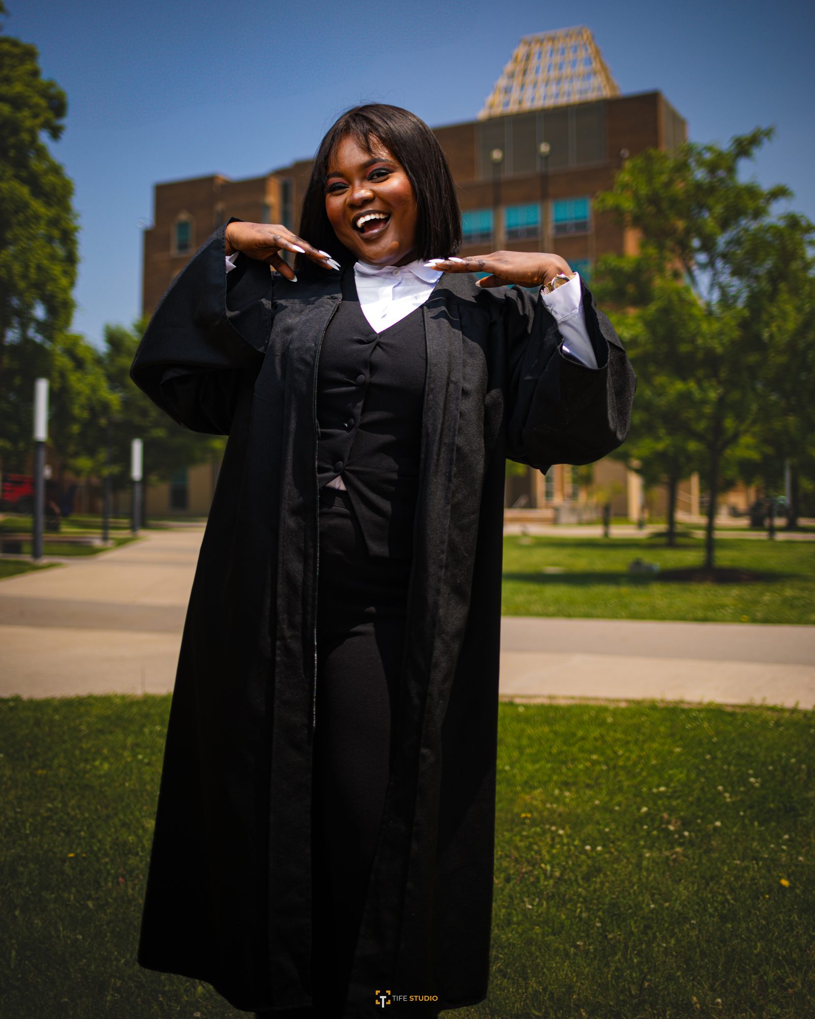 Happy graduate campus portrait